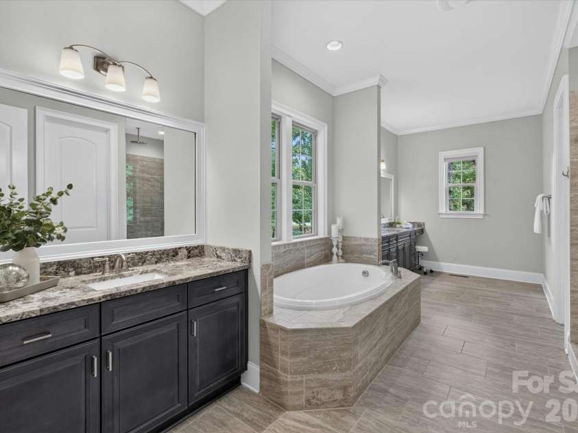 2020 Sherringham Way, Waxhaw, NC 28173.  MLS# CAR4390761, YatesRealty ID 37590. Owner's bath has two large separate vanity areas