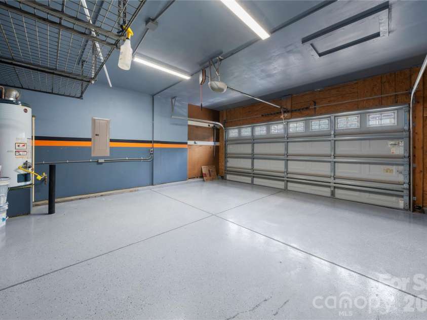 523 Danson Drive, Fort Mill, SC 29715.  MLS# CAR4392036, YatesRealty ID 37595. Garage with epoxy flooring & shleving