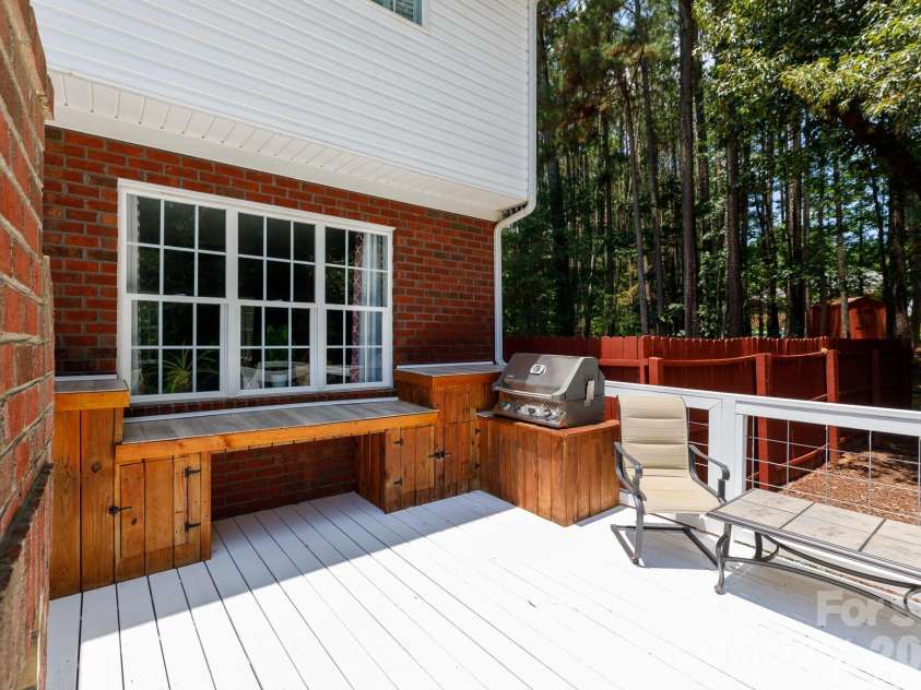 3009 Mamoth Oak Drive, Lancaster, SC 29720.  MLS# CAR4393141, YatesRealty ID 37598. Back yard kitchen with refrigerator for entertainement