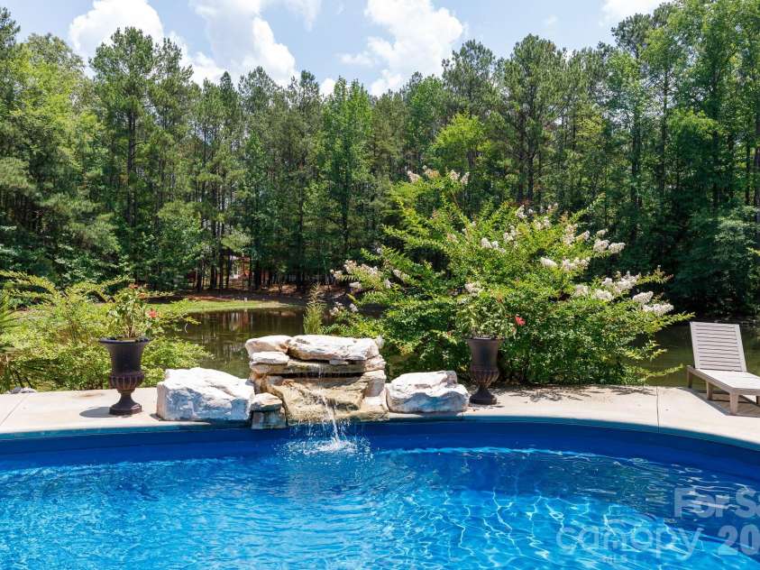 3009 Mamoth Oak Drive, Lancaster, SC 29720.  MLS# CAR4393141, YatesRealty ID 37598. Pool waterfall, WOW