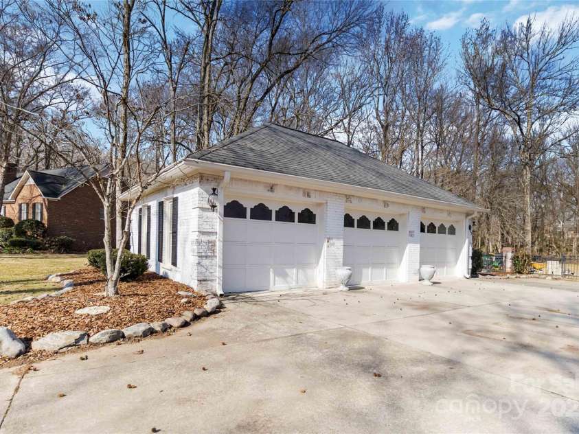 4001 Carmel Acres Drive, Charlotte, NC 28226.  MLS# CAR4256527, YatesRealty ID 3760. Detached 3 car garage that has a heating and cooling unit in the space.   Could be a great home gym or studio