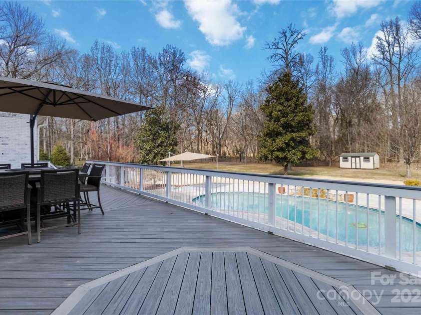 4001 Carmel Acres Drive, Charlotte, NC 28226.  MLS# CAR4256527, YatesRealty ID 3760. New Trex decking over looking pool