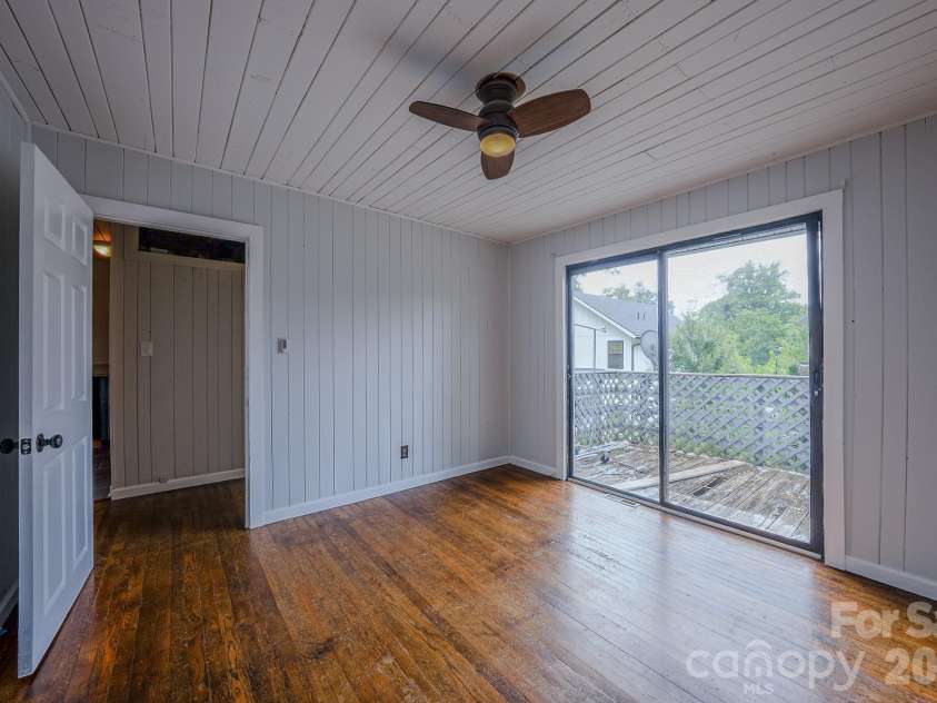 501 Fairview Road, Asheville, NC 28803.  MLS# CAR4393611, YatesRealty ID 37603. Bedroom 3 with small deck