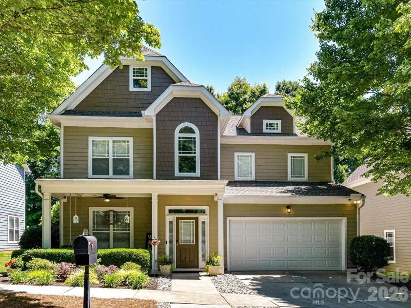 18814 Coachmans Trace, Cornelius, NC 28031.  MLS# CAR4399708, YatesRealty ID 37607. Beautifully maintained 4 bedroom, 2.5 bath home with timeless curb appeal, mature shade trees, and an inviting covered front porch in the charming Glenridge neighborhood.