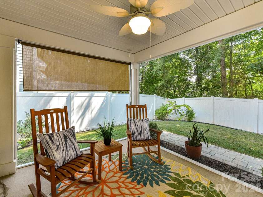 18814 Coachmans Trace, Cornelius, NC 28031.  MLS# CAR4399708, YatesRealty ID 37607. Relax year-round on the screened porch overlooking the private fenced backyard, creating the perfect space for morning coffee or evening unwinding.