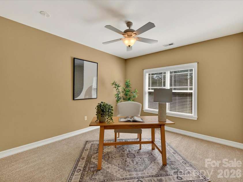 18814 Coachmans Trace, Cornelius, NC 28031.  MLS# CAR4399708, YatesRealty ID 37607. Versatile secondary bedroom is perfect for a home office, guest room, or playroom with ample space and a large closet.