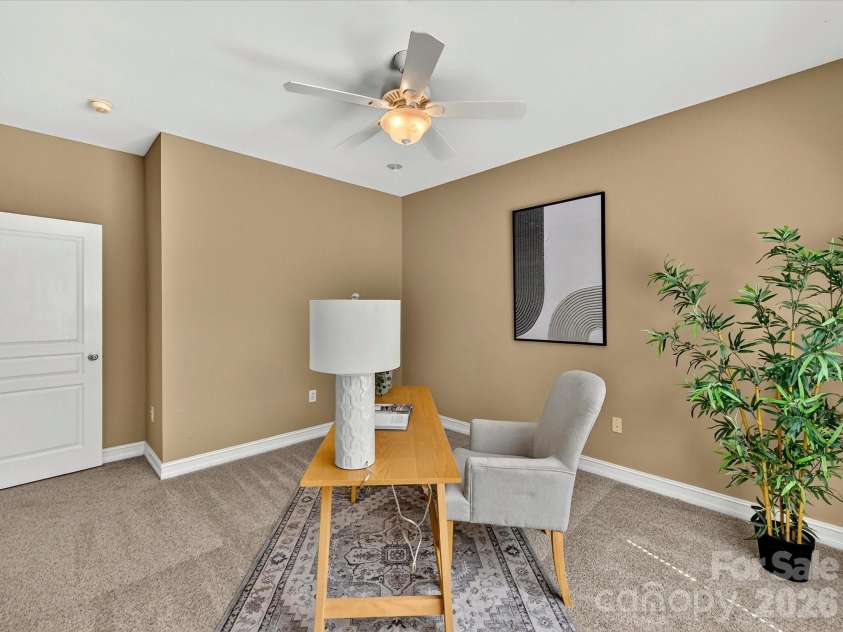 18814 Coachmans Trace, Cornelius, NC 28031.  MLS# CAR4399708, YatesRealty ID 37607. Versatile secondary bedroom is perfect for a home office, guest room, or playroom with ample space and a large closet.