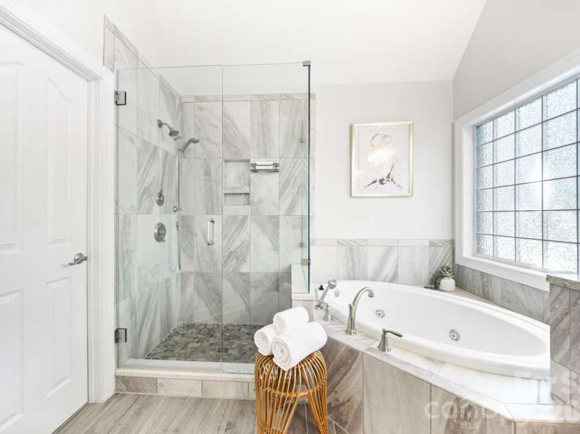 5355 Shannamara Drive, Matthews, NC 28104.  MLS# CAR4400014, YatesRealty ID 37611. Primary shower and jacuzzi tub