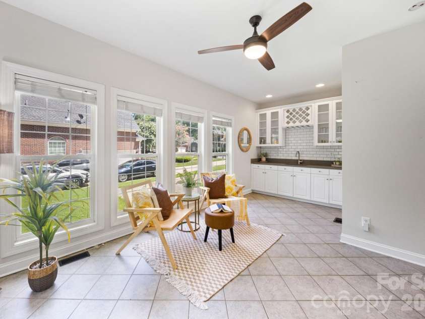 5355 Shannamara Drive, Matthews, NC 28104.  MLS# CAR4400014, YatesRealty ID 37611. Sunroom with wet bar