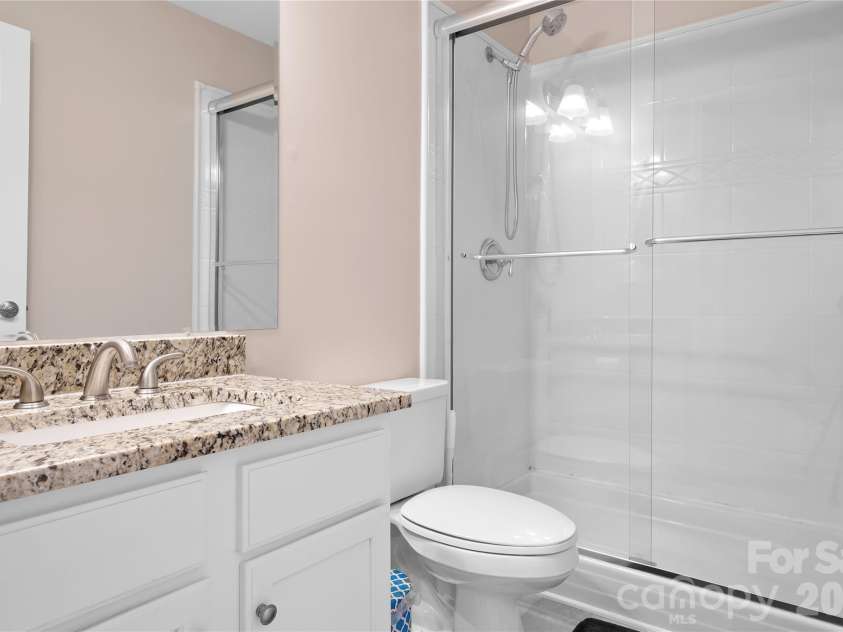 9407 Willow Tree Lane, Charlotte, NC 28277.  MLS# CAR4401791, YatesRealty ID 37631. Guest bath with granite countertops.