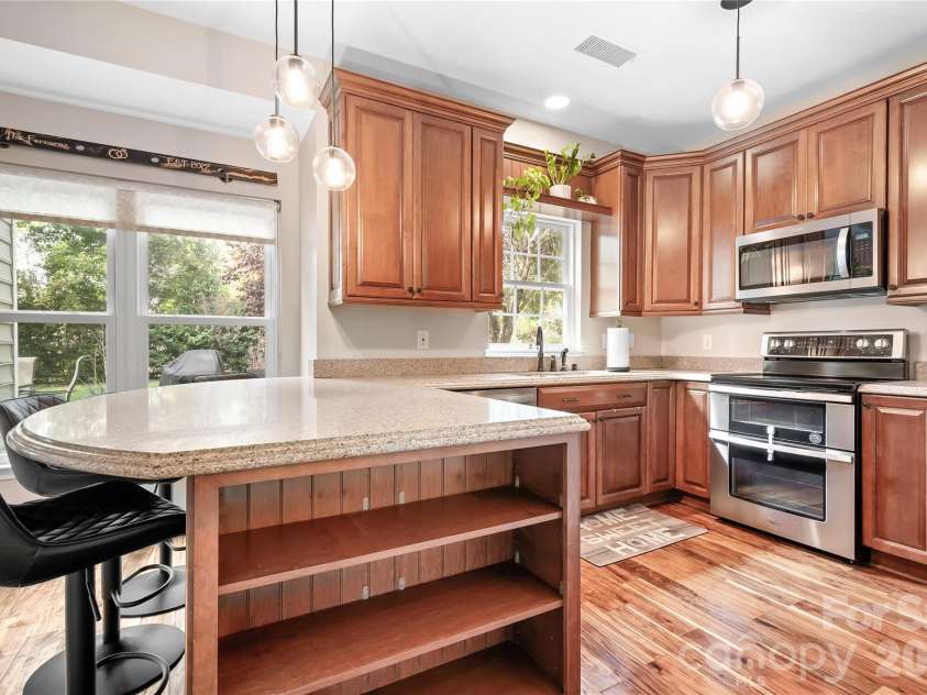 9407 Willow Tree Lane, Charlotte, NC 28277.  MLS# CAR4401791, YatesRealty ID 37631. Open kitchen with granite counter tops
