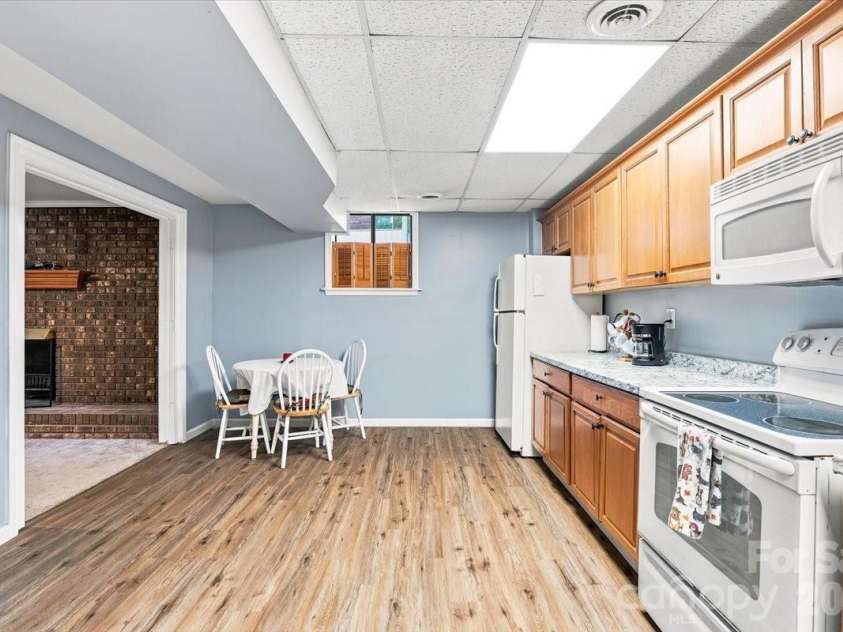 216 Dundeve Circle, Hendersonville, NC 28792.  MLS# CAR4403940, YatesRealty ID 37633. Basement kitchen