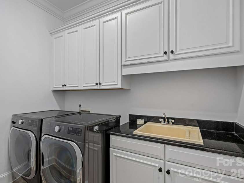 3813 Lakeside Drive, Charlotte, NC 28270.  MLS# CAR4403586, YatesRealty ID 37638. Main Floor Laundry Room