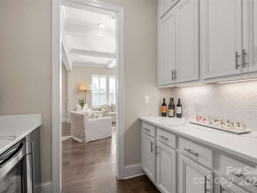 105 Downton Abbey Drive, Marvin, NC 28173.  MLS# CAR4332508, YatesRealty ID 3764. Butlers pantry connects the formal dining room to the kitchen - Features wine fridge and ice maker
