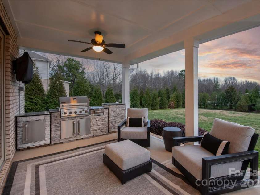 105 Downton Abbey Drive, Marvin, NC 28173.  MLS# CAR4332508, YatesRealty ID 3764. Evenings on the covered porch with grilling station