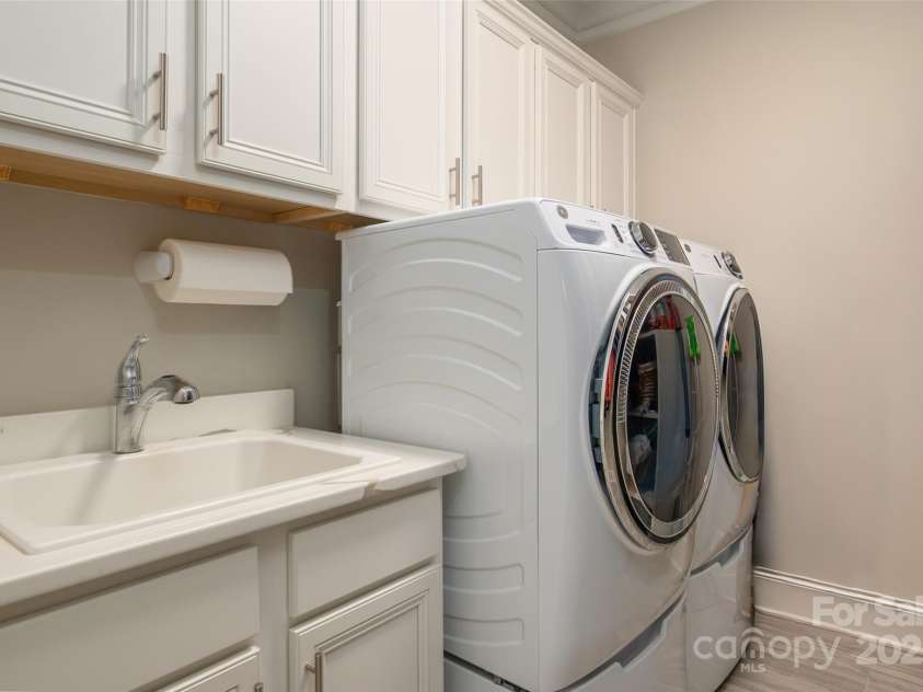 105 Downton Abbey Drive, Marvin, NC 28173.  MLS# CAR4332508, YatesRealty ID 3764. Laundry upgraded with cabinetry is located on upper level and has direct access to primary bath