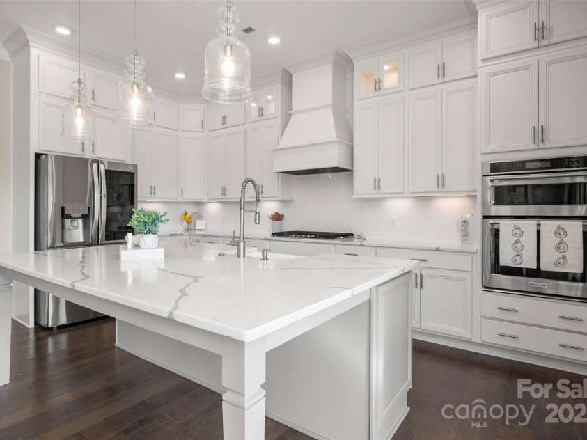 105 Downton Abbey Drive, Marvin, NC 28173.  MLS# CAR4332508, YatesRealty ID 3764. Oversized center island with quarts provides for additional seating