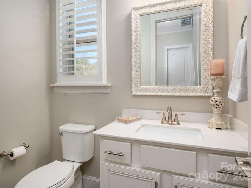 105 Downton Abbey Drive, Marvin, NC 28173.  MLS# CAR4332508, YatesRealty ID 3764. Powder bath conveniently located near kitchen and rear entry