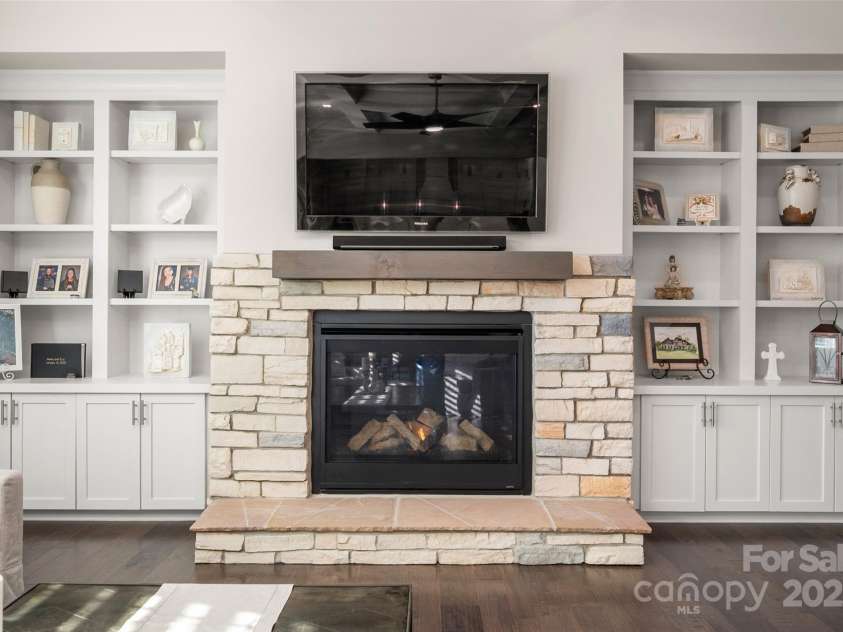 105 Downton Abbey Drive, Marvin, NC 28173.  MLS# CAR4332508, YatesRealty ID 3764. Stone fireplace with built-in cabnetry