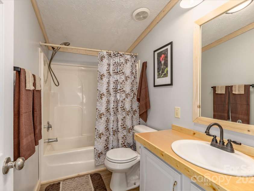 459 Vaughn Road, Spruce Pine, NC 28777.  MLS# CAR4240761, YatesRealty ID 3764. Guest bath