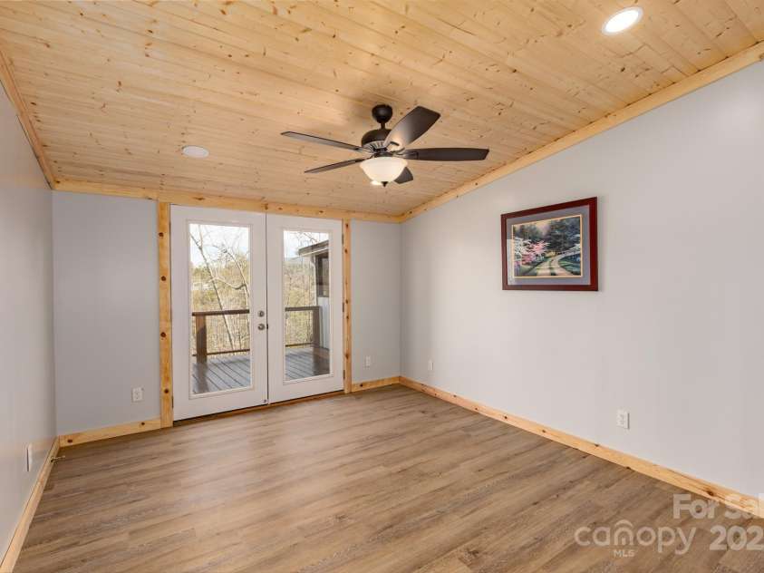 459 Vaughn Road, Spruce Pine, NC 28777.  MLS# CAR4240761, YatesRealty ID 3764. Sitting room off Primary with french doors to deck.