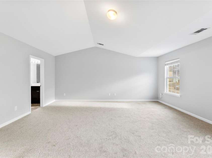 5305 Park Brook Drive, Charlotte, NC 28269.  MLS# CAR4336100, YatesRealty ID 3766. Primary bedroom w/vaulted 
