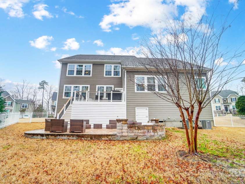 1126 Snowbird Lane, Waxhaw, NC 28173.  MLS# CAR4222147, YatesRealty ID 3767. Backyard with upper level deck and ground level paver patio.