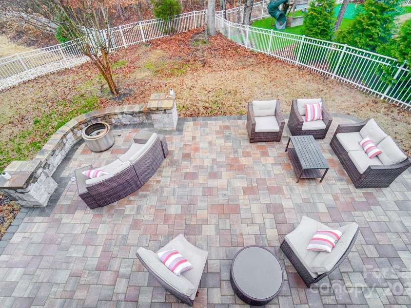 1126 Snowbird Lane, Waxhaw, NC 28173.  MLS# CAR4222147, YatesRealty ID 3767. Looking down from the deck to the patio.