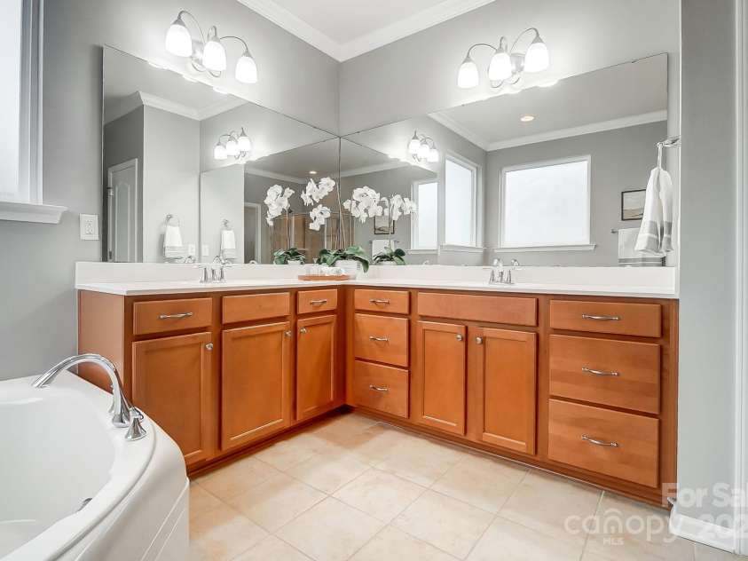 1126 Snowbird Lane, Waxhaw, NC 28173.  MLS# CAR4222147, YatesRealty ID 3767. Primary bathroom with dual sinks.