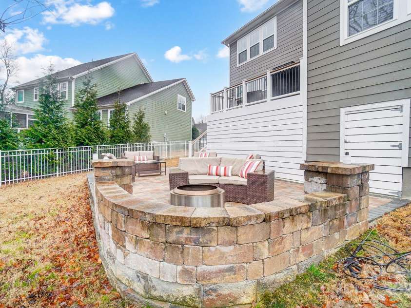 1126 Snowbird Lane, Waxhaw, NC 28173.  MLS# CAR4222147, YatesRealty ID 3767. Stone wall for additional seating.