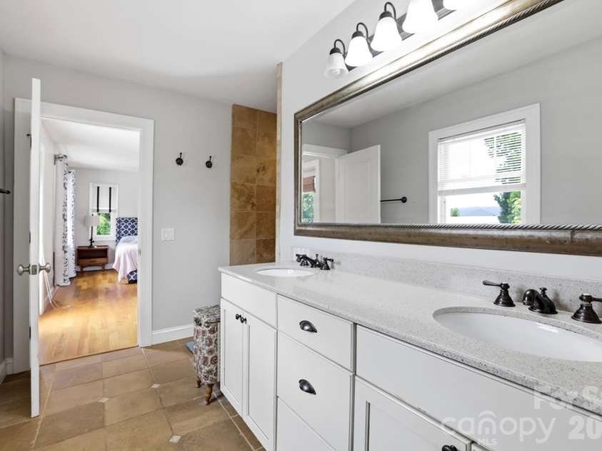 26 Crestwood Drive, Arden, NC 28704.  MLS# CAR4400337, YatesRealty ID 37672. Double sinks and walk in shower