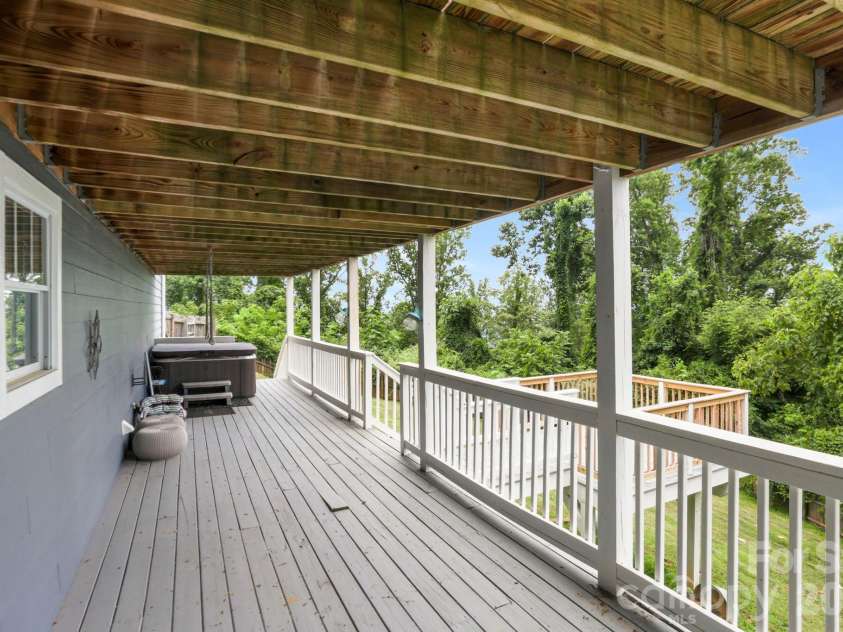 26 Crestwood Drive, Arden, NC 28704.  MLS# CAR4400337, YatesRealty ID 37672. Lower Deck with Hot Tub