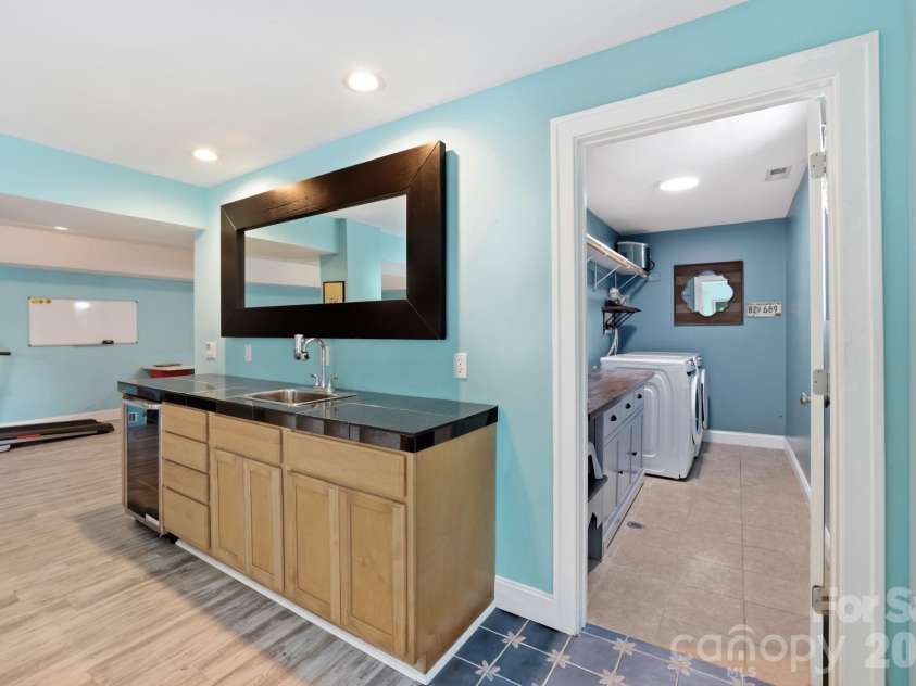 26 Crestwood Drive, Arden, NC 28704.  MLS# CAR4400337, YatesRealty ID 37672. Wet bar and wine fridge