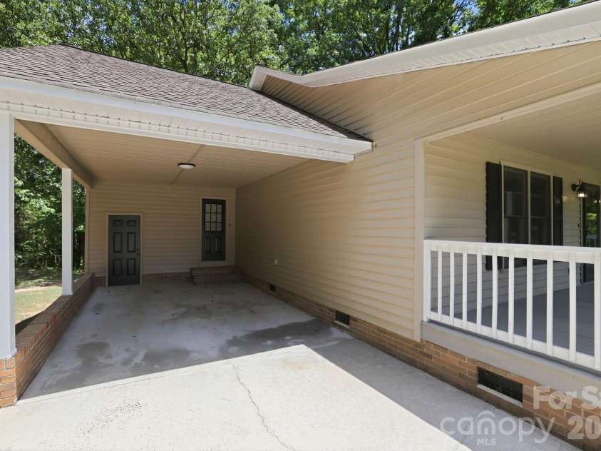 1801 Bridgewood Drive, Lancaster, SC 29720.  MLS# CAR4401979, YatesRealty ID 37676. Carport and laundry room entry