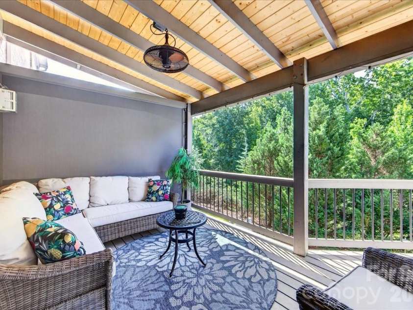 3093 Hartson Pointe Drive, Fort Mill, SC 29707.  MLS# CAR4402189, YatesRealty ID 37679. Covered deck with stair that have a landing leading to backyard patio with firepit