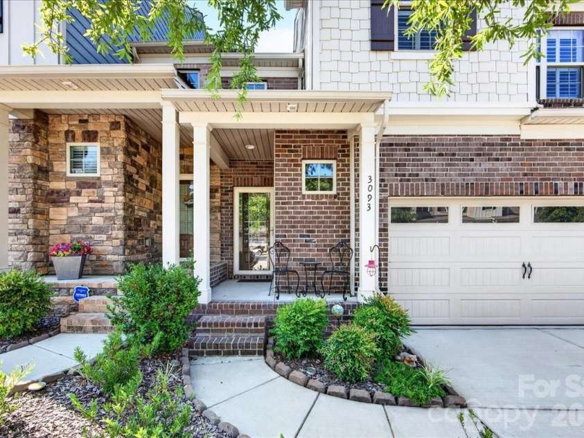 3093 Hartson Pointe Drive, Fort Mill, SC 29707.  MLS# CAR4402189, YatesRealty ID 37679. Front porch with 394SF two car garage