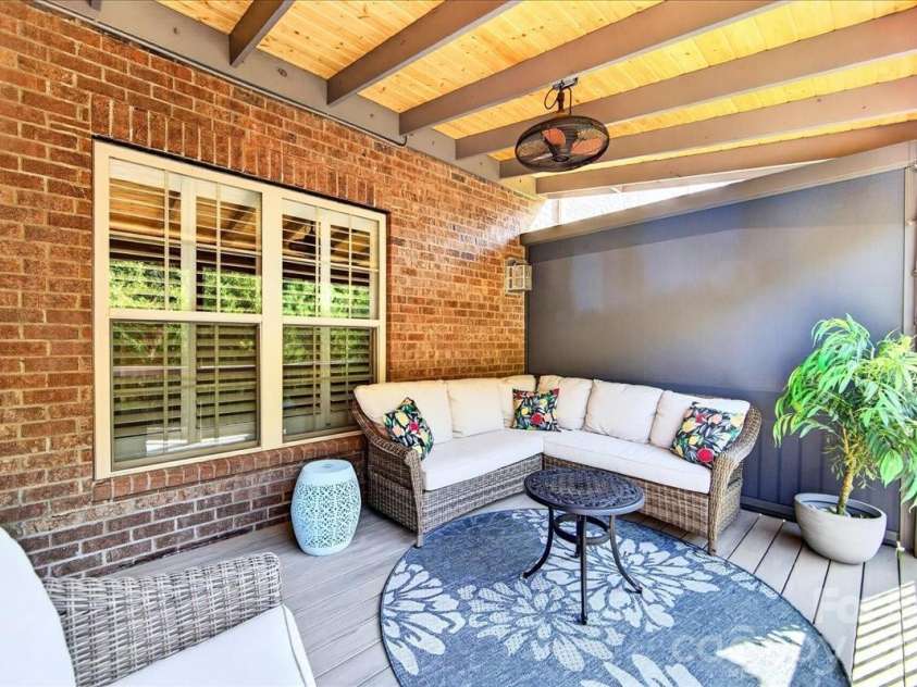 3093 Hartson Pointe Drive, Fort Mill, SC 29707.  MLS# CAR4402189, YatesRealty ID 37679. Large Covered Deck overlook tree lined landscape