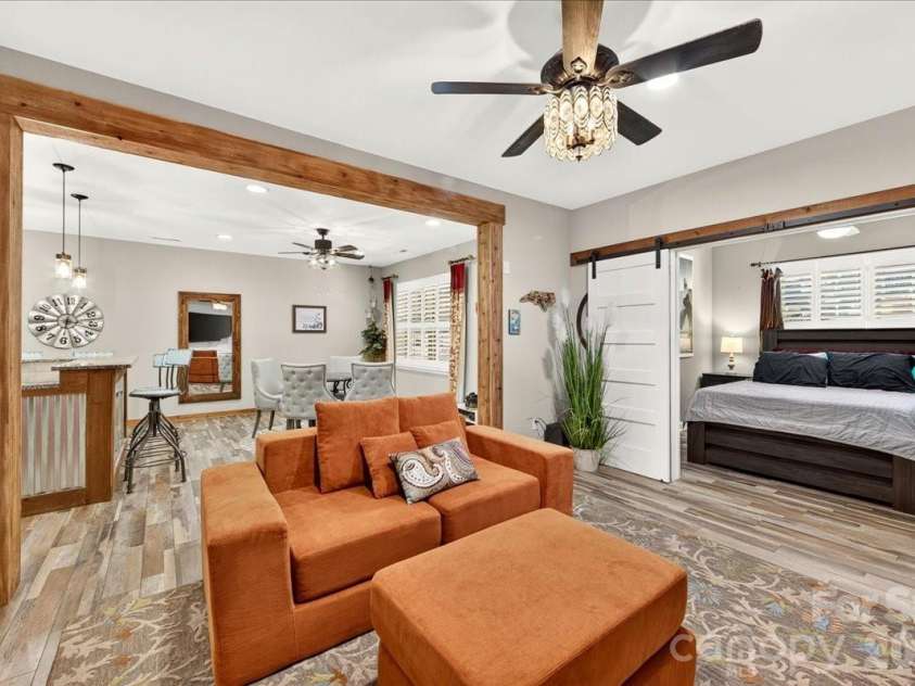 3093 Hartson Pointe Drive, Fort Mill, SC 29707.  MLS# CAR4402189, YatesRealty ID 37679. Living room barn doors with separate bedroom