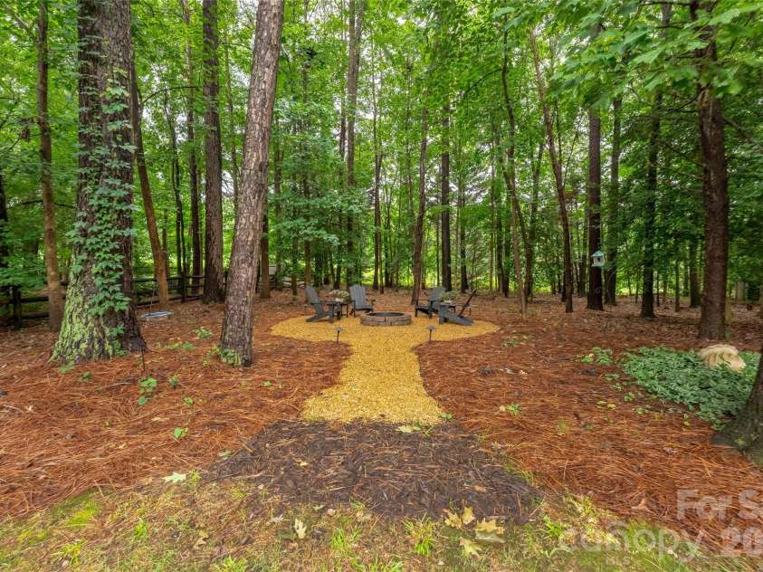 4034 Nicole Eileen Lane, Charlotte, NC 28216.  MLS# CAR4403119, YatesRealty ID 37687. Fire pit and private backyard