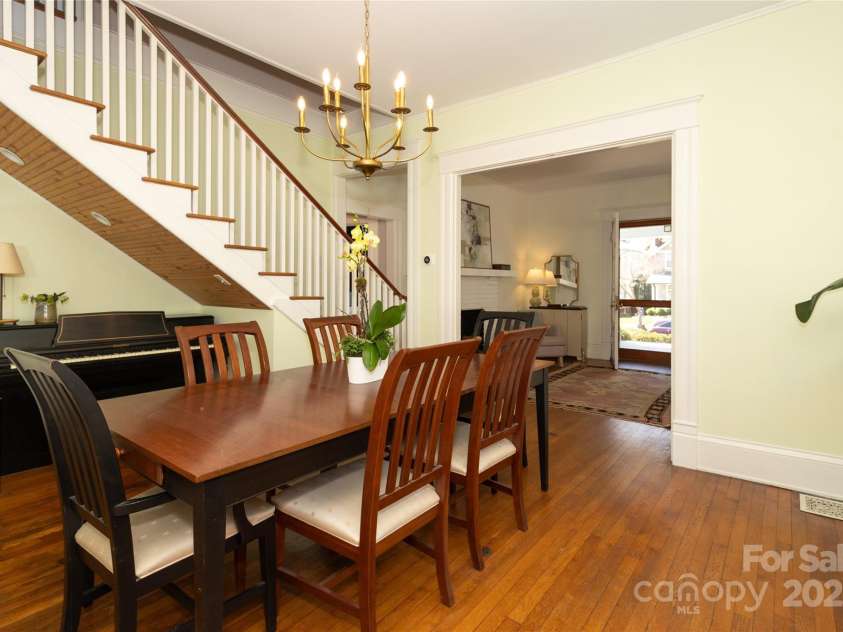809 Worthington Avenue, Charlotte, NC 28203.  MLS# CAR4230687, YatesRealty ID 3769. A quaint nook tucked under the staircasea perfect place for a piano or a bar setup