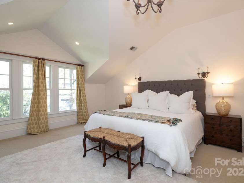 809 Worthington Avenue, Charlotte, NC 28203.  MLS# CAR4230687, YatesRealty ID 3769. Primary bedroom with vaulted ceilings