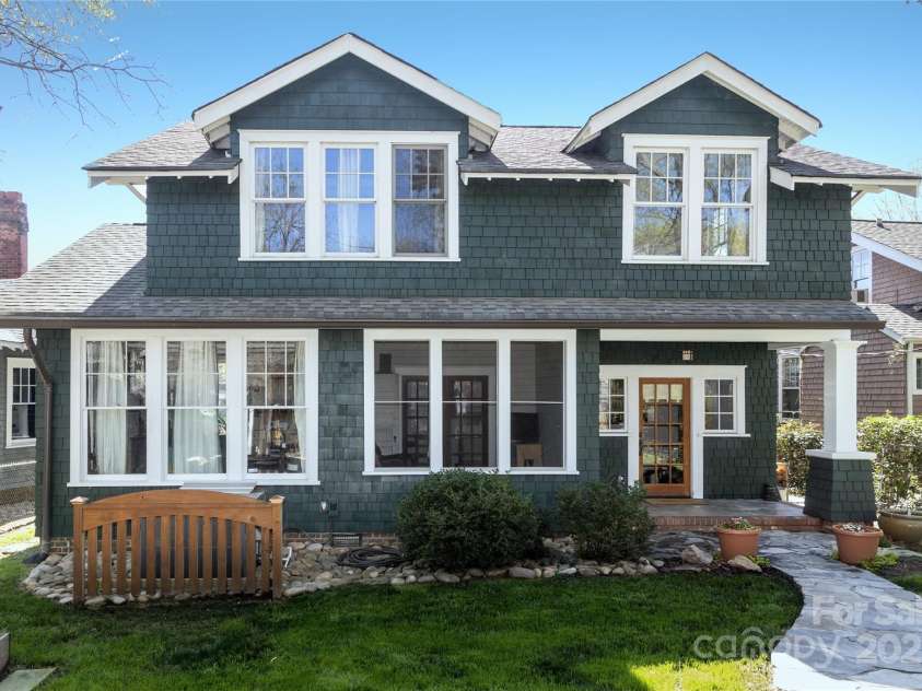 809 Worthington Avenue, Charlotte, NC 28203.  MLS# CAR4230687, YatesRealty ID 3769. Rear view of the home with stonewalkways and a typical Dilworth backyard.