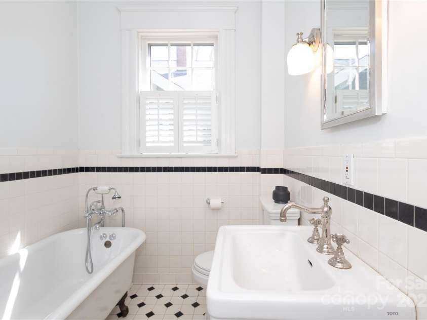 809 Worthington Avenue, Charlotte, NC 28203.  MLS# CAR4230687, YatesRealty ID 3769. Remodeled bath with claw foot tub and high end plumbing fixtures