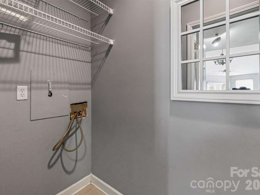797 Peninsula Drive, Davidson, NC 28036.  MLS# CAR4403741, YatesRealty ID 37700. Laundry room off of kitchen