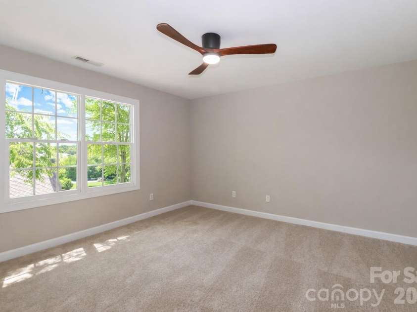 119 Shelter Cove Lane, Mooresville, NC 28117.  MLS# CAR4365805, YatesRealty ID 37707. Upper level bedroom with ensuite.