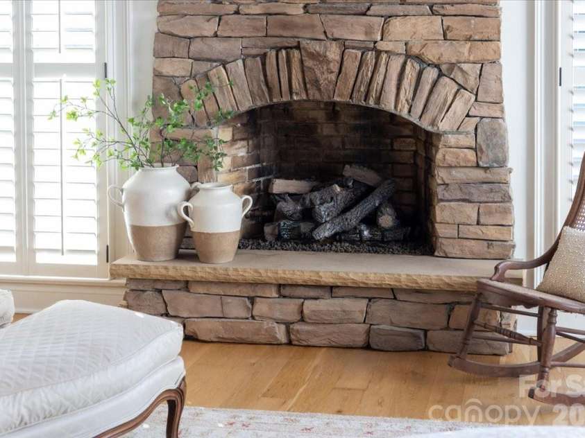 21300 Blakely Shores Drive, Cornelius, NC 28031.  MLS# CAR4416103, YatesRealty ID 37733. Fireplace in primary bedroom