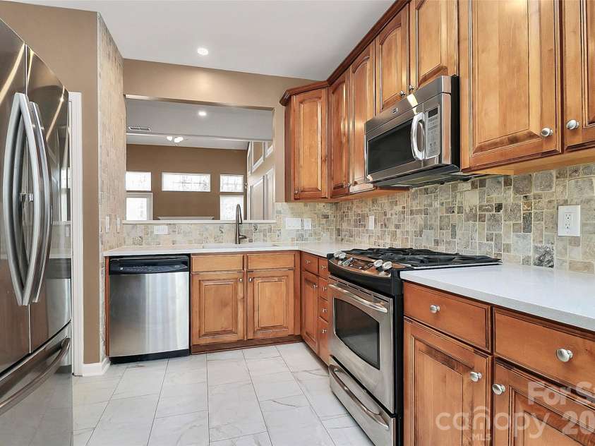 9411 Shumacher Avenue, Concord, NC 28027.  MLS# CAR4324917, YatesRealty ID 3774. Frig stays!