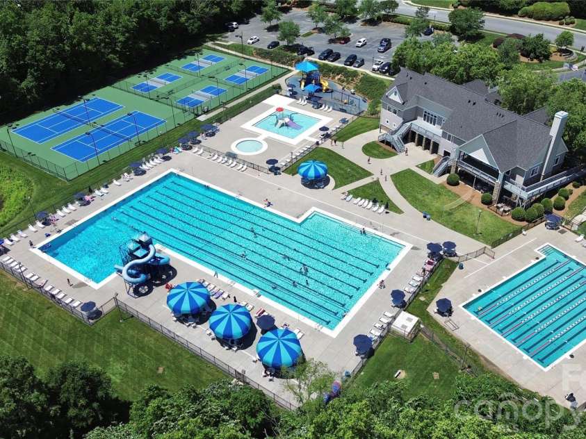 9411 Shumacher Avenue, Concord, NC 28027.  MLS# CAR4324917, YatesRealty ID 3774. Olympic size pool with 2 slides!!