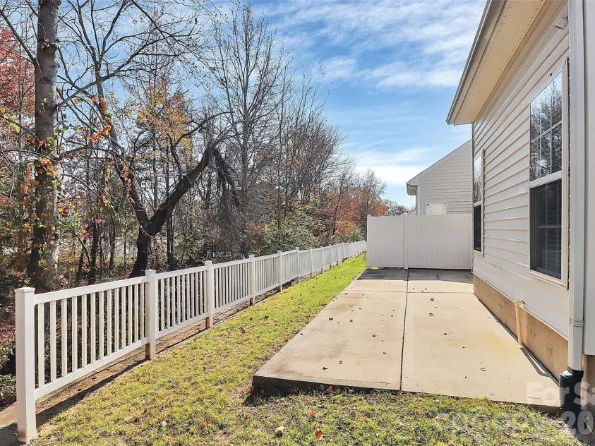 9411 Shumacher Avenue, Concord, NC 28027.  MLS# CAR4324917, YatesRealty ID 3774. Private backyard - lots of trees and wooded area 