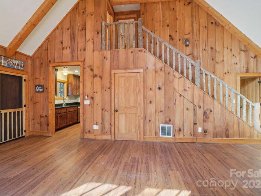 102 Knobster Way, Glenville, NC 28736.  MLS# CAR4325693, YatesRealty ID 3776. Coming back in through the screen porch,